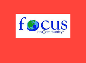 The Focus on Community logo on a red background.