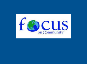 The Focus on Community logo on a dark blue background.