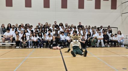 Students from Julian Thomas gathered with Bango and the Rim Rockers
